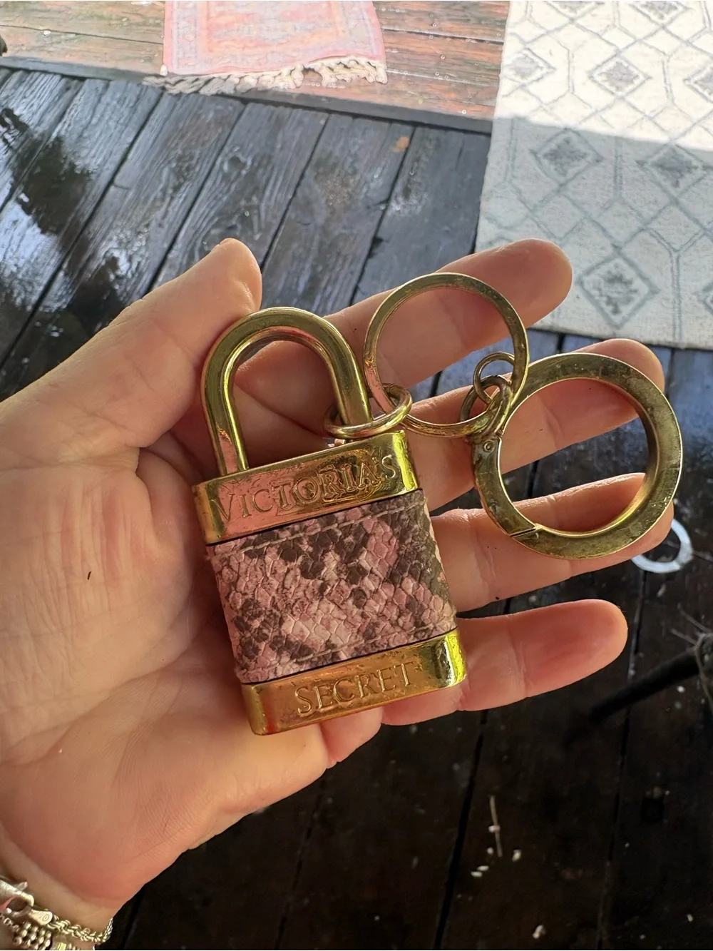 Victoria's Secret padlock keychain features a rose gold finish and a pink snakes